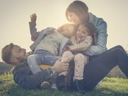 A family playing together on grass